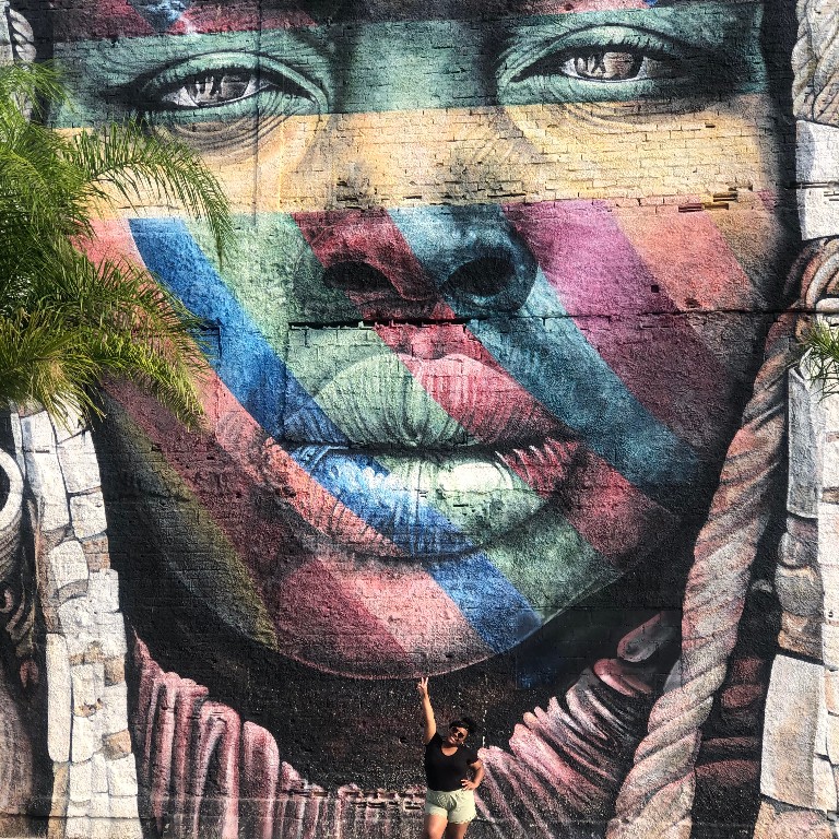 Chyna Johnson in front of a mural in Little Africa in Rio de Janiero while studying in Brazil with HIEP in 2019